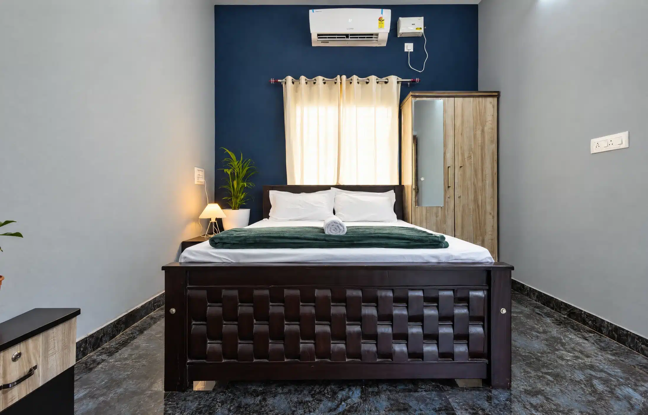 Standard couple room interior with queen bed and window