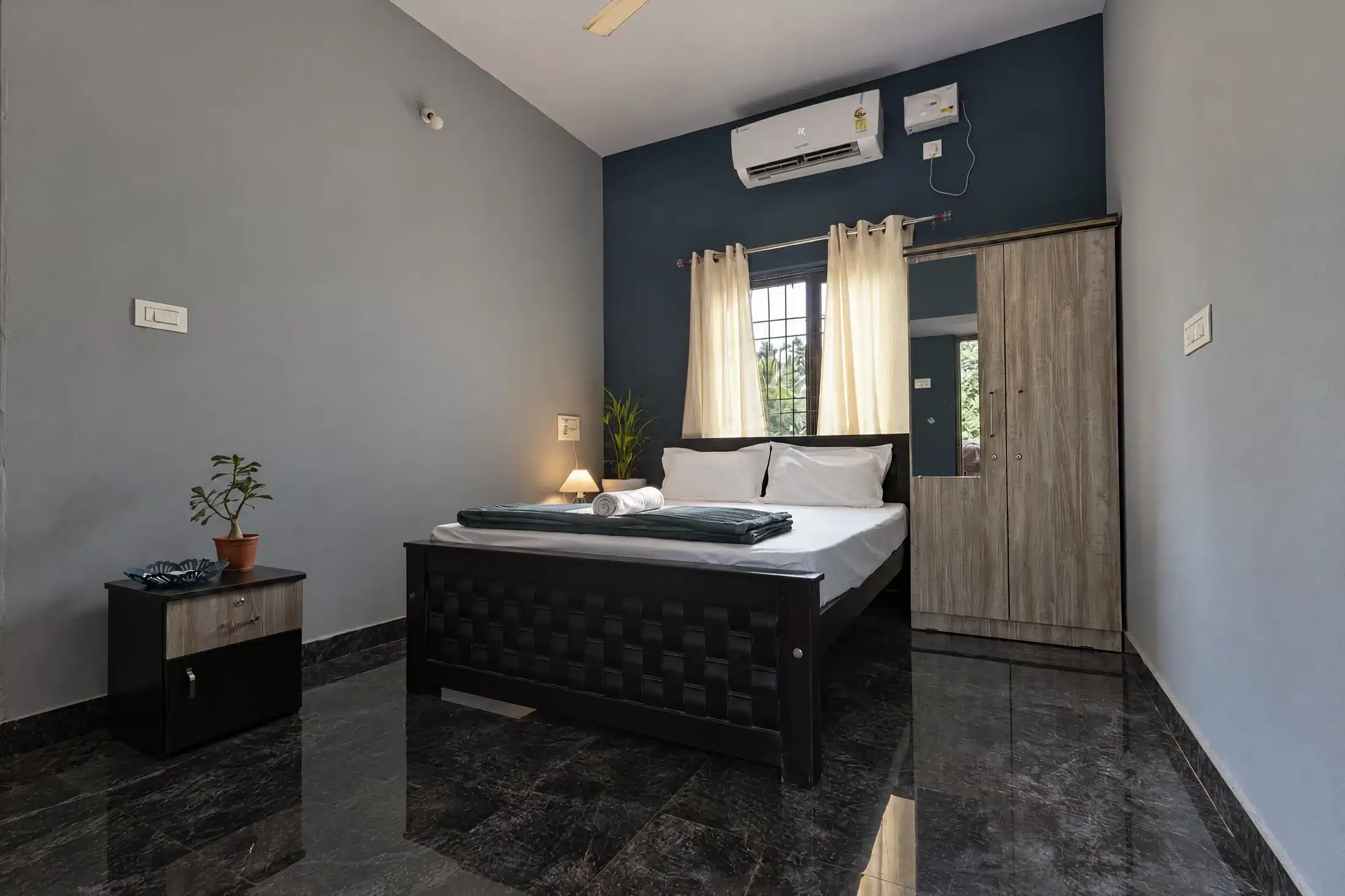 Home Standard couple room at Lopez Paradise with queen bed, air conditioning and wardrobe
